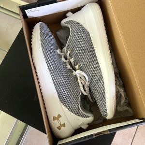 Like new Under Armor white with grey athletic shoes. Size 9.5, comes with box.